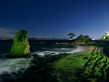 Mt. fuji and starry sky over the sea from tateishi park