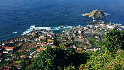 High angle view of town by sea