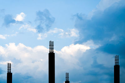 Low angle view of communications tower against sky