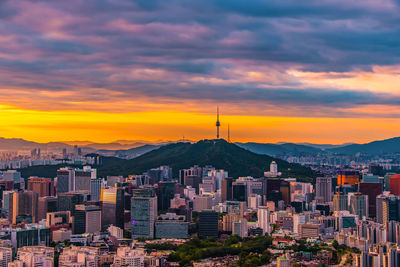 Cityscape against sky during sunset