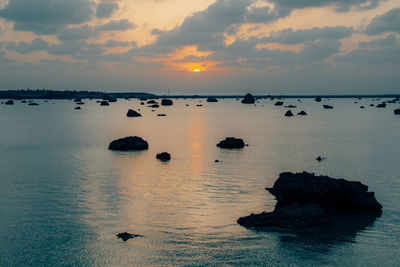 Scenic view of sea against sky during sunset