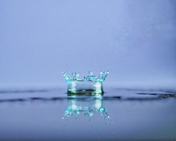 Close-up of splashing water against glass