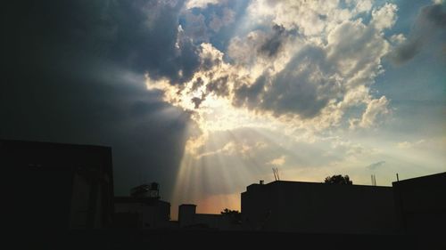 Low angle view of building against cloudy sky