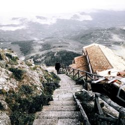 Railroad tracks leading towards mountains