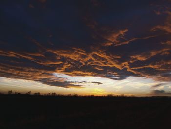 Scenic view of landscape against sky at sunset