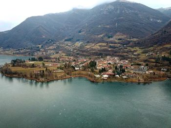 Aerial view of river amidst buildings in town