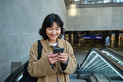 Young woman using mobile phone