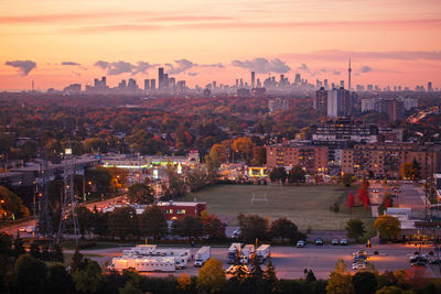 Aerial view of city buildings during sunset