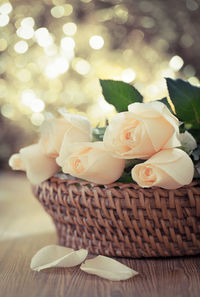 Close-up of roses in basket on table