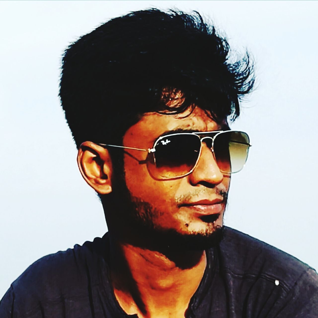sunglasses, real people, one person, young adult, mid adult, front view, looking at camera, lifestyles, portrait, mid adult men, head and shoulders, black hair, young men, leisure activity, headshot, outdoors, day, sky, clear sky, smiling, young women, close-up