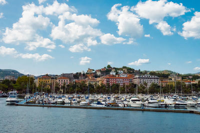 Boats moored at harbor