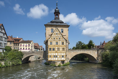 Old town hall in the center of bamberg with ancient center with bridges, flowers and timbered houses