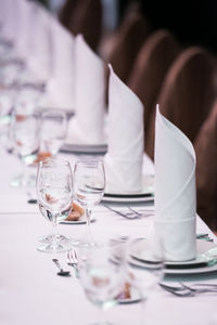 High angle view of drinking glasses and napkins on table