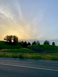 Scenic view of field against sky during sunset