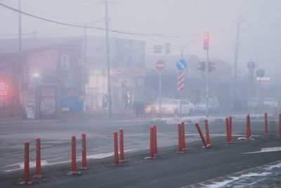 Road by city street during foggy weather