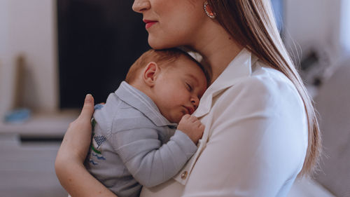 Midsection of mother and baby girl