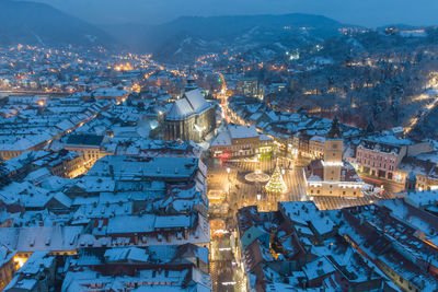 High angle view of buildings in city during winter