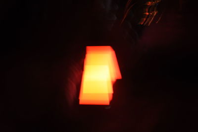 Close-up of illuminated lamp at night