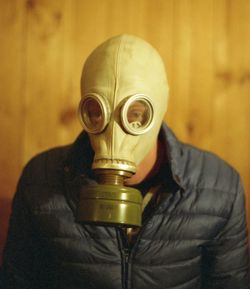 Close-up of man wearing gas mask