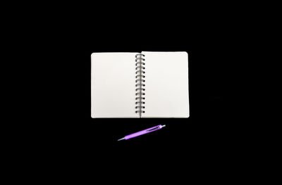Directly above shot of book against black background