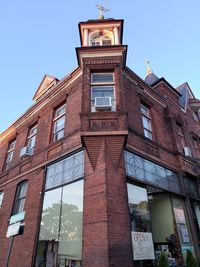 Low angle view of building against clear blue sky