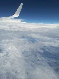 Aerial view of clouds over landscape against sky