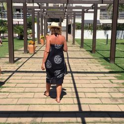 Rear view of women standing in corridor