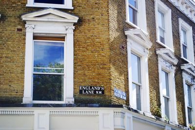 Sign boards with text on building wall