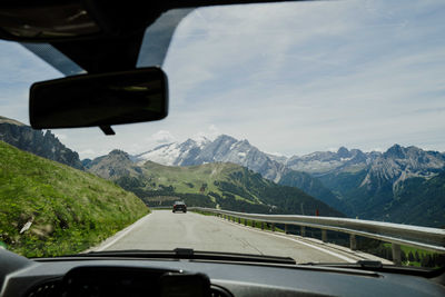 Car on the road in the dolomites