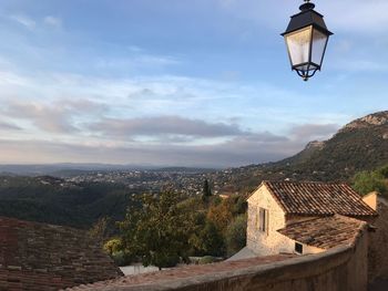 View of roof and mountains against sky
