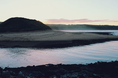 Scenic view of sea against sky at sunset