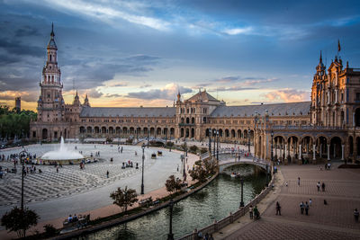 View of buildings against cloudy sky