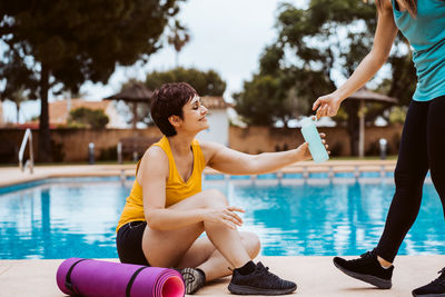 Side view of woman exercising in gym