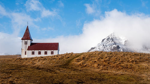 Panoramic view of building on mountain against sky