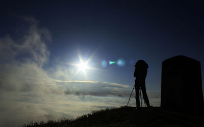 Silhouette of man standing on mountain