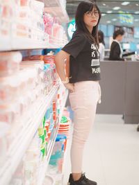 Portrait of woman standing in supermarket