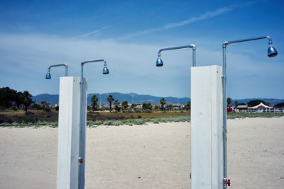 Scenic view of beach against blue sky