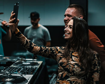 Close-up of young woman using mobile phone