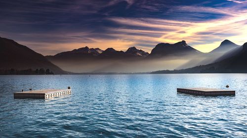 Scenic view of lake against sky during sunset