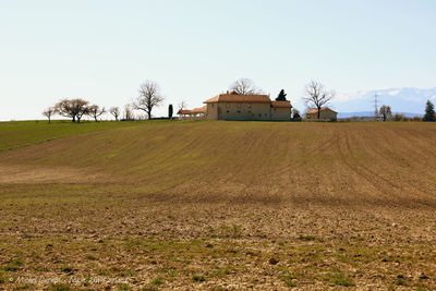 House on field against sky