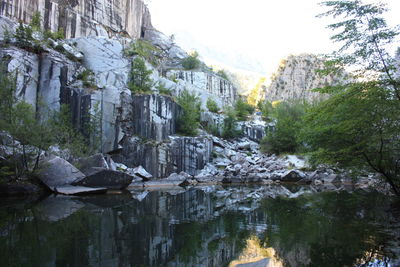 Small natural lake inside a marble quarry in mountain in apuan alps