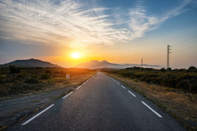 Road against sky during sunset