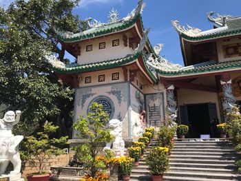 Low angle view of statue against temple