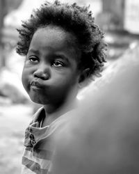 Close-up of young woman looking away