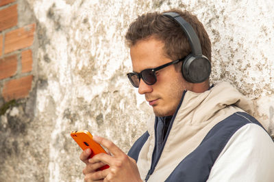 Young man with headphones and mobile phone