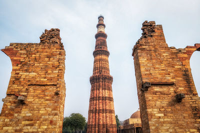 Low angle view of old temple building against sky