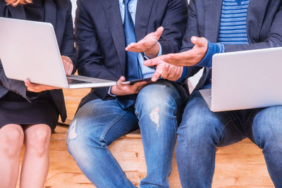 Low angle view of man using laptop