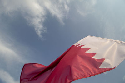 Low angle view of qatari flag against sky