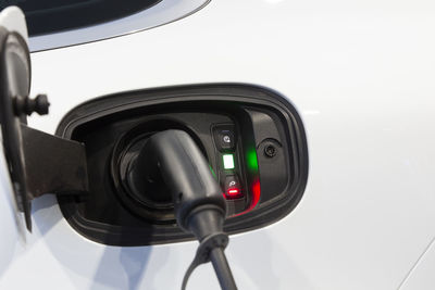 Close-up of security camera against white background