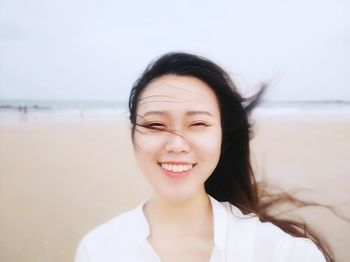 Close-up of young woman at beach